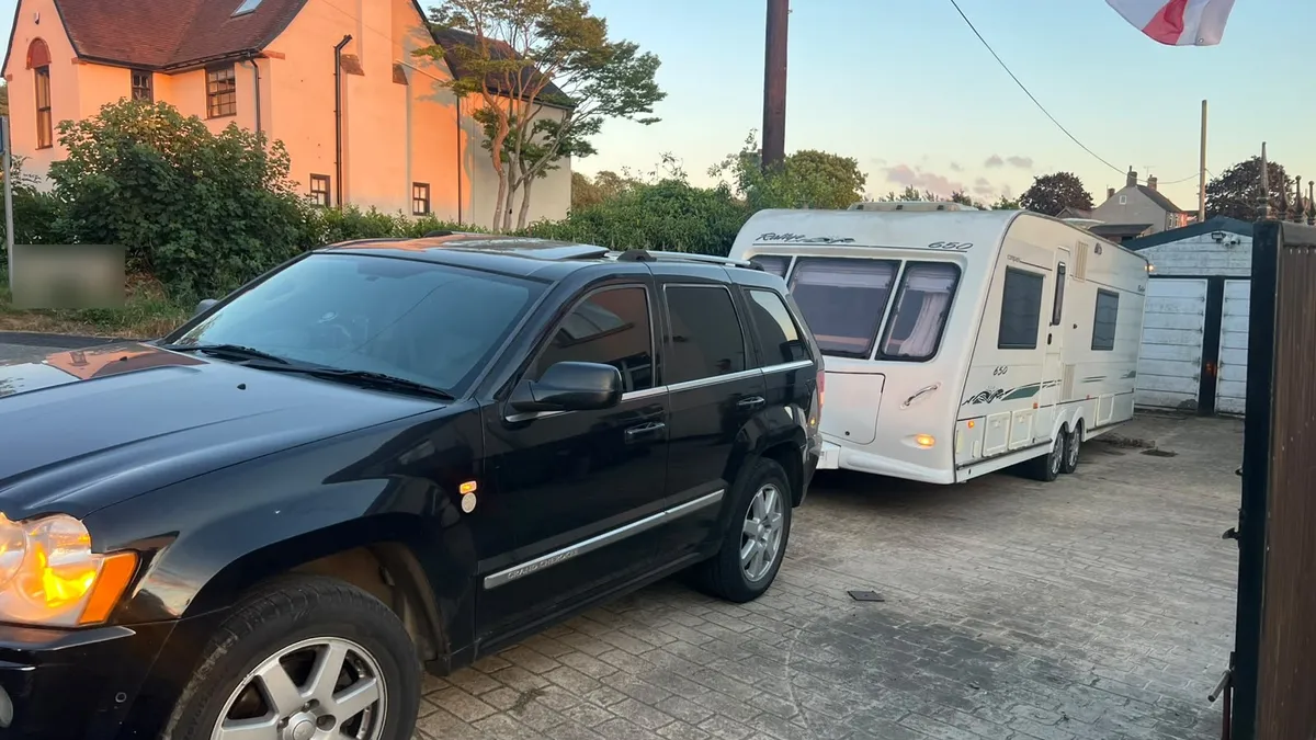 Compass Rallye 650 twin-axle caravan on a driveway, ready for collection